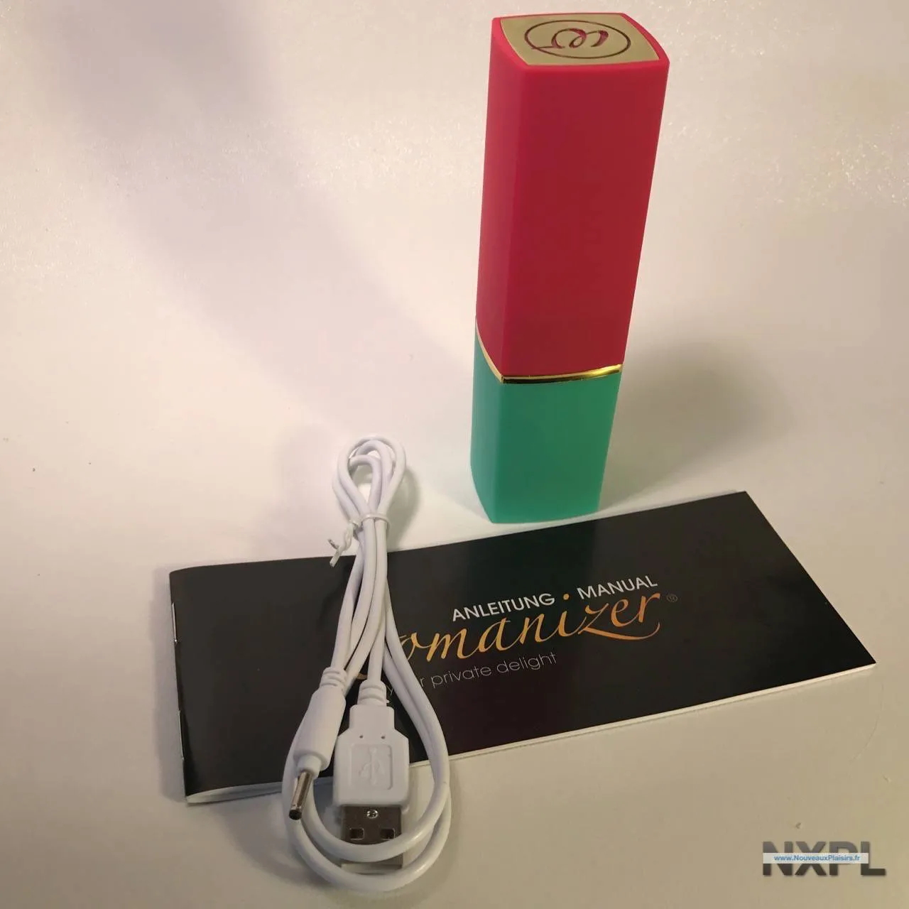 Womanizer 2Go dans son emballage, couleurs vert, or et rose